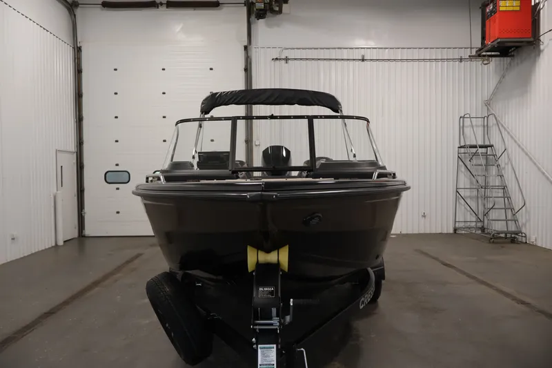 Slide: The Image of 2026 Crestliner 2050 Sportfish boat in a garage, front view. - 1