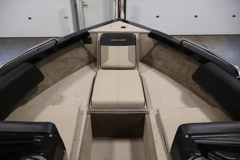 Slide: The Image of 2026 Crestliner 2050 Sportfish boat interior with beige seating and black accents. - 13