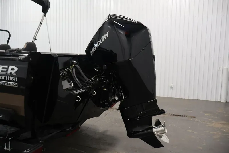 Slide: The Image of 2026 Crestliner 2050 Sportfish with Mercury outboard motor in a showroom. - 33