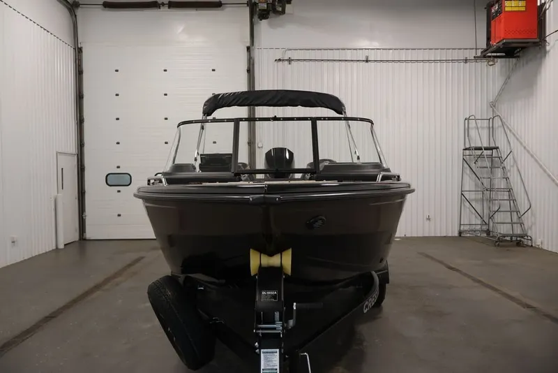 Slide: The Image of 2026 Crestliner 2050 Sportfish boat in a garage, front view. - 6