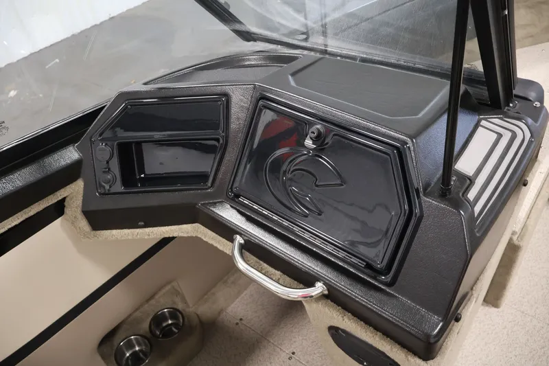 Slide: The Image of 2026 Crestliner 2050 Sportfish dashboard with sleek black panel and storage compartment. - 24