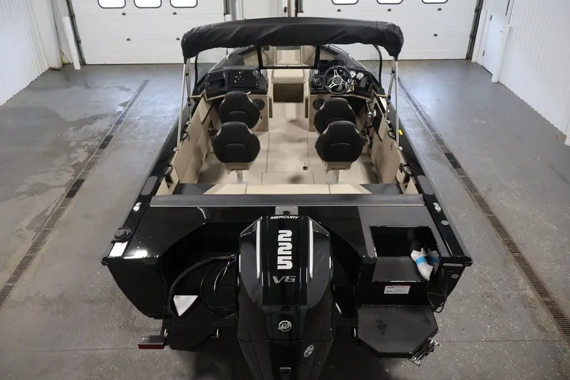 Slide: The Image of 2026 Crestliner 2050 Sportfish boat with Mercury 225 V6 engine in a garage. - 12