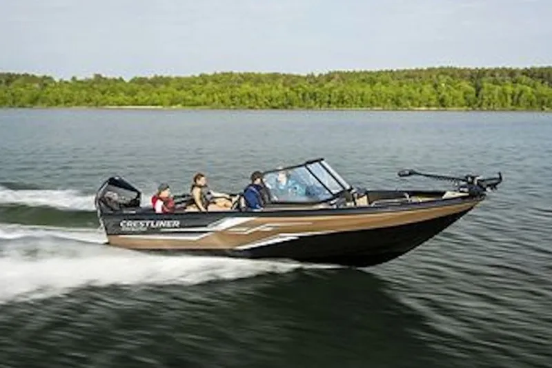 Slide: The Image of 2026 Crestliner 2050 Sportfish boat cruising on a lake with passengers onboard. - 6