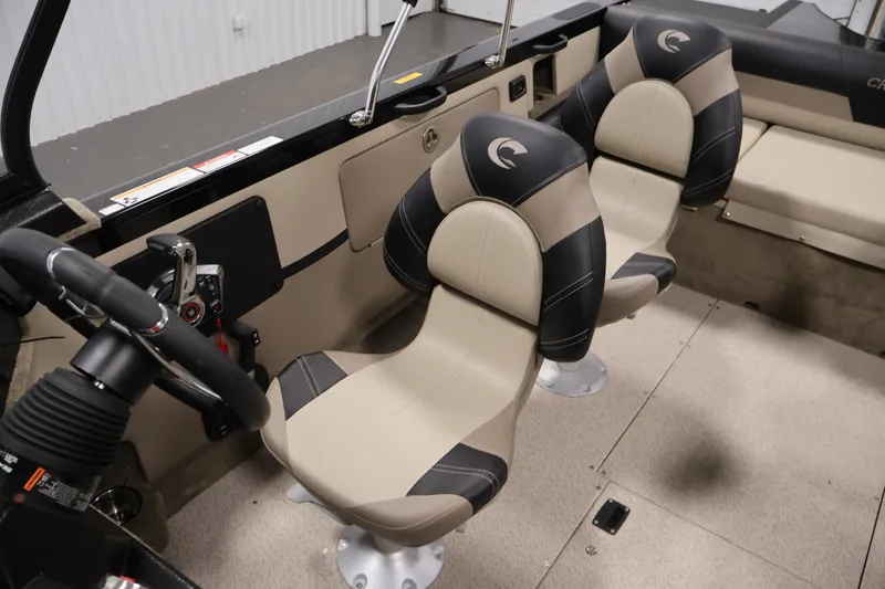 Slide: The Image of Interior of 2026 Crestliner 2050 Sportfish boat with stylish seating and steering wheel. - 23