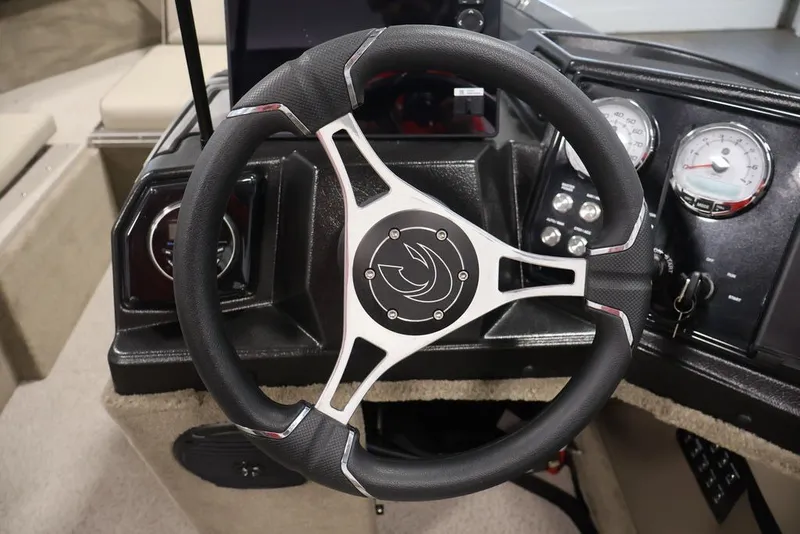 Slide: The Image of Steering wheel and dashboard of 2026 Crestliner 2050 Sportfish boat. - 25