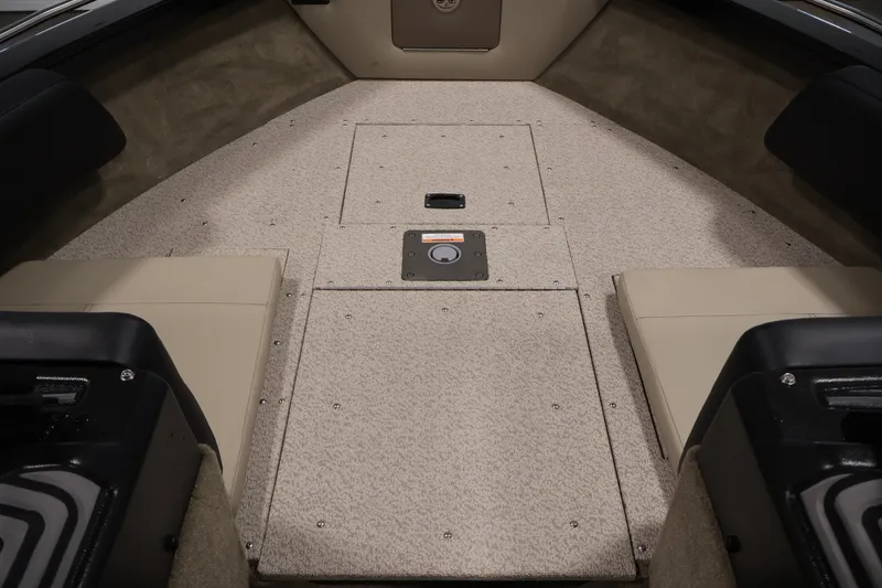 Slide: The Image of 2026 Crestliner 2050 Sportfish boat interior with beige seating and carpeted flooring. - 13