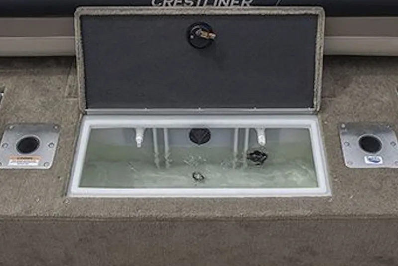 Slide: The Image of Livewell compartment on 2026 Crestliner 2050 Sportfish boat, featuring water circulation system. - 5
