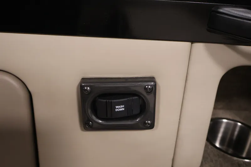 Slide: The Image of Wash down switch on 2026 Crestliner 2050 Sportfish boat interior panel. - 33