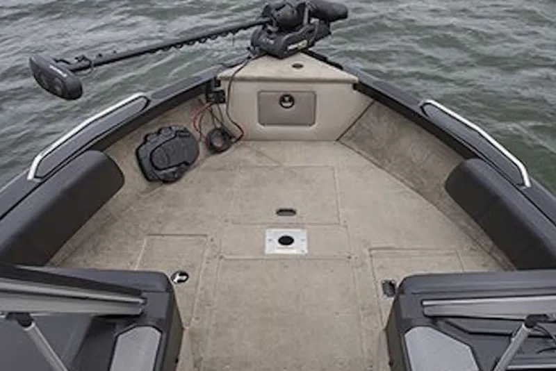 Slide: The Image of 2026 Crestliner 2050 Sportfish boat interior with trolling motor on calm water. - 7