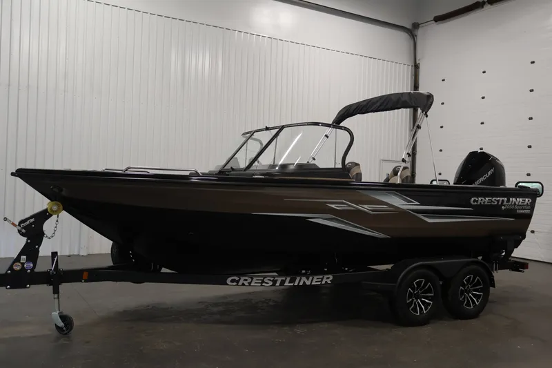 Slide: The Image of 2026 Crestliner 2050 Sportfish boat on trailer in indoor showroom. - 7
