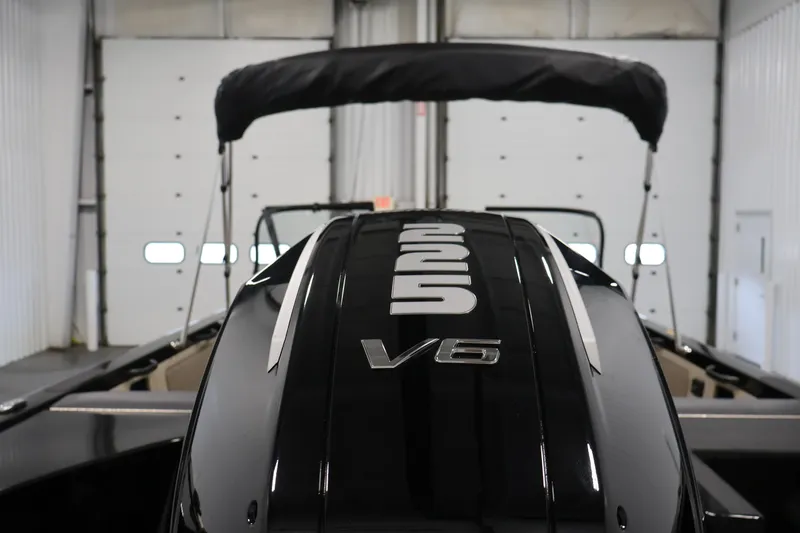 Slide: The Image of 2026 Crestliner 2050 Sportfish boat with V6 engine in a garage setting. - 36