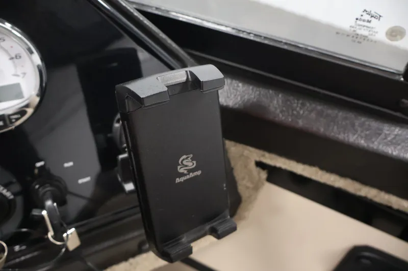 Slide: The Image of Dashboard of 2026 Crestliner 2050 Sportfish with phone holder and gauge. - 21