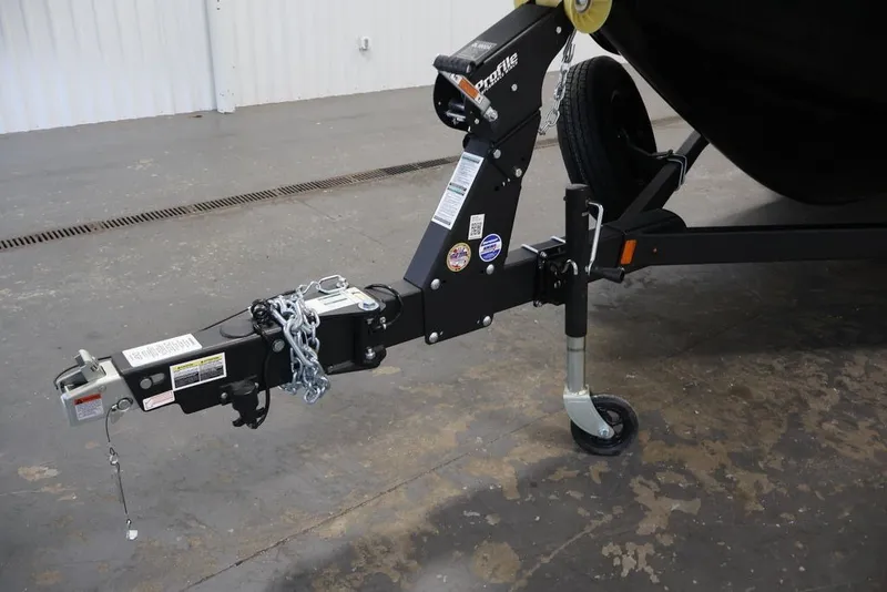 Slide: The Image of Trailer hitch of 2026 Crestliner 2050 Sportfish boat in a garage setting. - 32