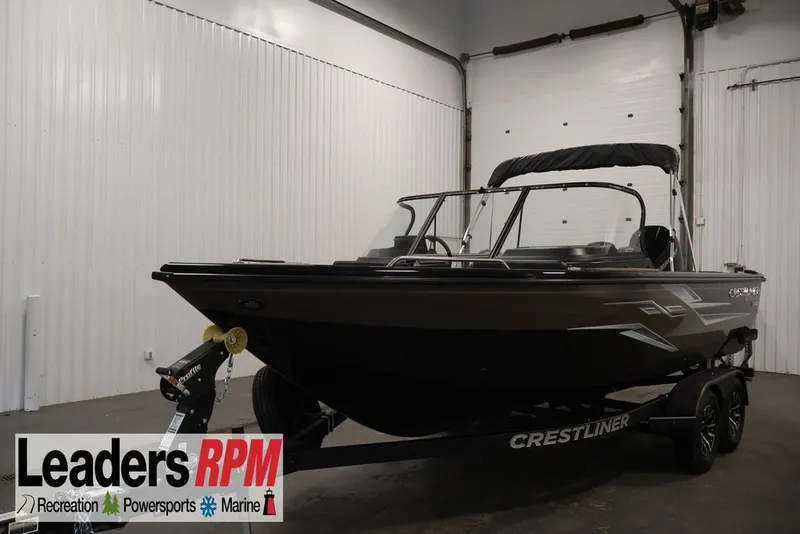 Slide: The Image of 2026 Crestliner 2050 Sportfish boat on trailer in indoor showroom. - 1