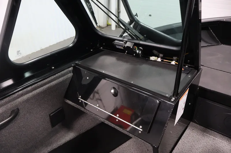 Slide: The Image of Interior of 2026 Crestliner 2050 Commander boat, featuring sleek black dashboard design. - 21