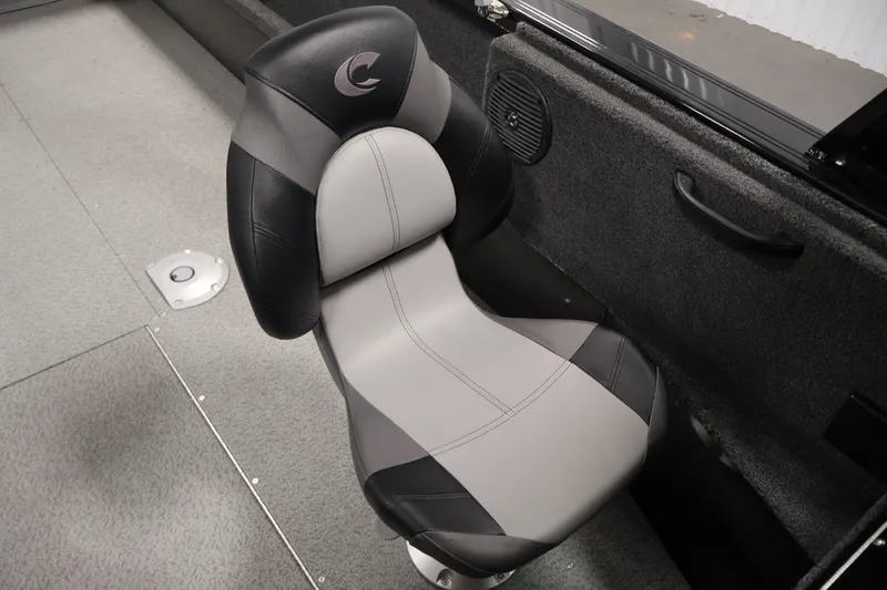 Slide: The Image of 2026 Crestliner 2050 Commander boat seat, black and gray design, interior view. - 22