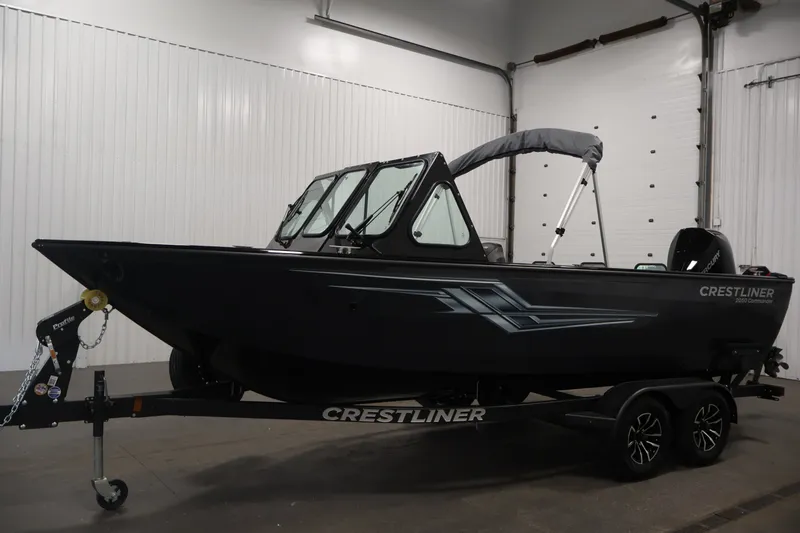 Slide: The Image of 2026 Crestliner 2050 Commander boat on trailer in indoor storage facility. - 7