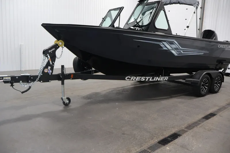 Slide: The Image of 2026 Crestliner 2050 Commander boat on trailer in indoor setting. - 37