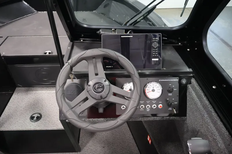 Slide: The Image of 2026 Crestliner 2050 Commander dashboard with steering wheel and navigation controls. - 13