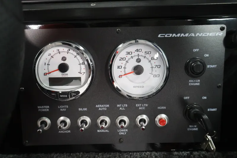 Slide: The Image of Dashboard of 2026 Crestliner 2050 Commander with gauges and control switches. - 16