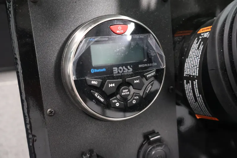 Slide: The Image of Boss Audio System control panel on 2026 Crestliner 2050 Commander boat dashboard. - 18