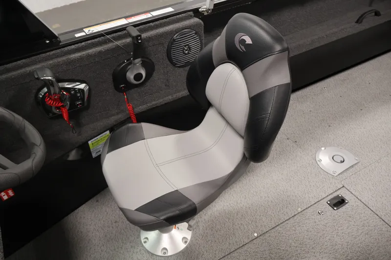 Slide: The Image of Captain's seat in 2026 Crestliner 2050 Commander boat, featuring ergonomic design and modern controls. - 20