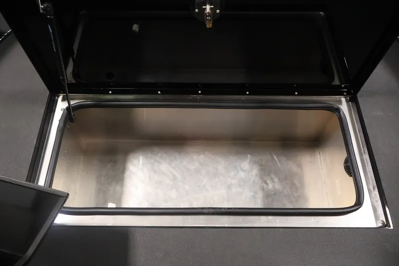 Slide: The Image of Open storage compartment in 2026 Crestliner 2050 Commander boat. - 9