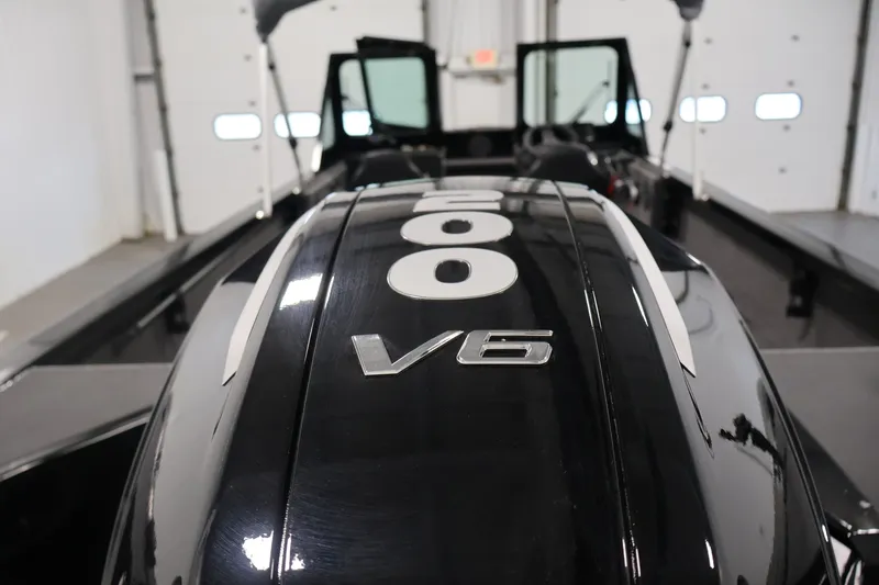 Slide: The Image of 2026 Crestliner 2050 Commander boat with V6 engine in a showroom. - 30