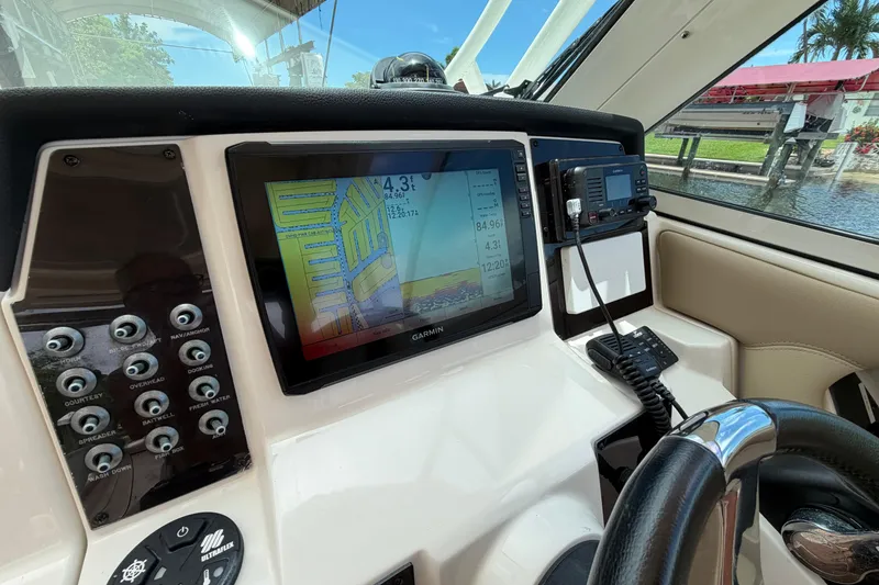 Slide: The Image of Dashboard of 2018 Sailfish 325 DC boat with Garmin navigation system. - 17