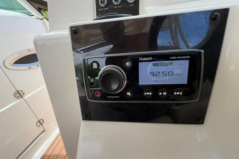 Slide: The Image of Fusion MS-RA205 radio on 2018 Sailfish 325 DC boat dashboard, tuned to 92.50 MHz FM. - 20