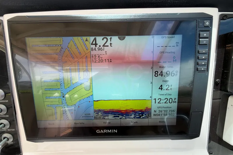 Slide: The Image of Garmin marine GPS display on Sailfish 325 DC, showing depth, water temperature, and location coordinates. - 21