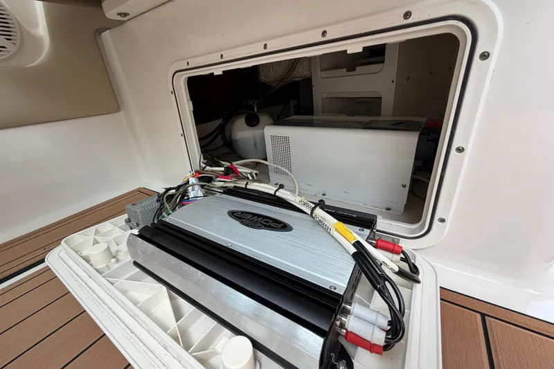 Slide: The Image of Electrical compartment of a 2018 Sailfish 325 DC boat, showcasing wiring and components. - 22