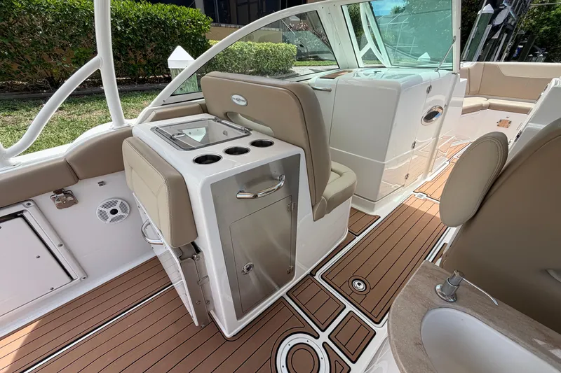 Slide: The Image of Interior of 2018 Sailfish 325 DC boat with seating and modern amenities. - 31