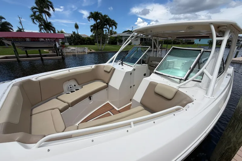 Slide: The Image of 2018 Sailfish 325 DC boat with spacious seating and sleek design. - 5