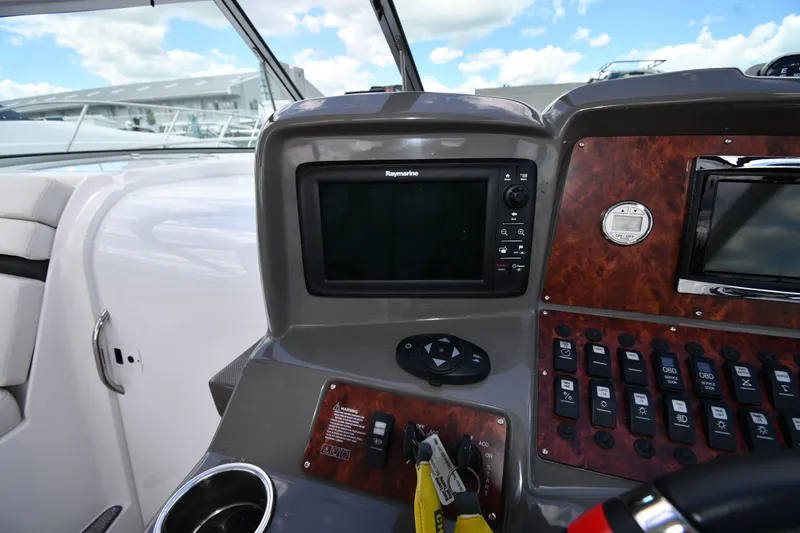 Slide: The Image of Control panel of a 2017 Rinker EX 320 boat with navigation system. - 14