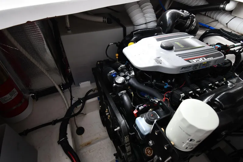 Slide: The Image of Engine compartment of a 2017 Rinker EX 320 boat with a 350 MAG engine. - 42