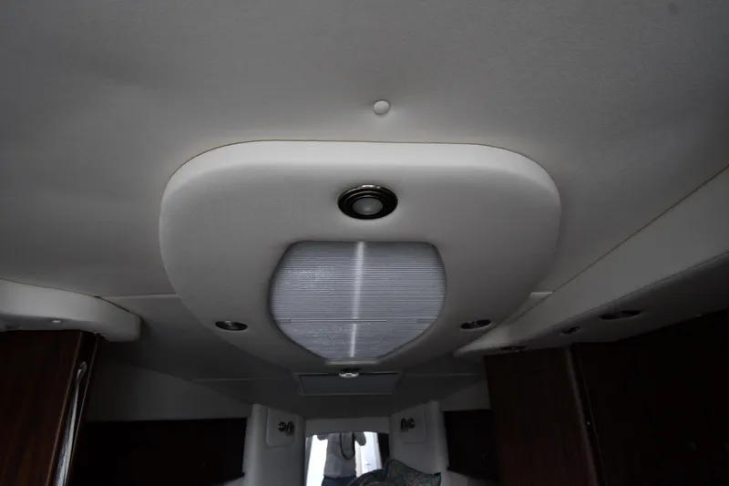 Slide: The Image of Ceiling interior of 2017 Rinker EX 320 boat with lighting fixtures. - 43