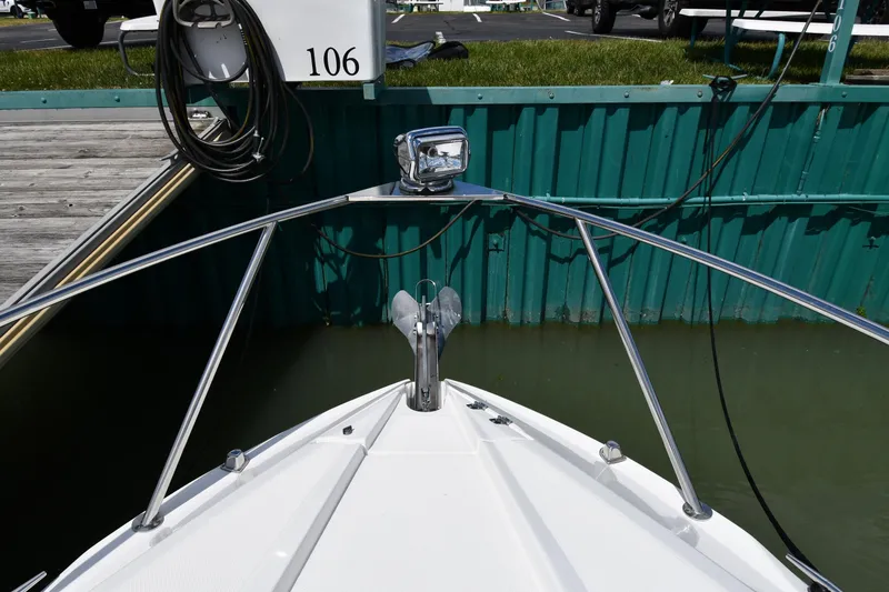 Slide: The Image of Bow of 2017 Rinker EX 320 boat docked at slip 106. - 5