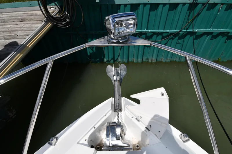 Slide: The Image of Bow of 2017 Rinker EX 320 boat with anchor and spotlight. - 6