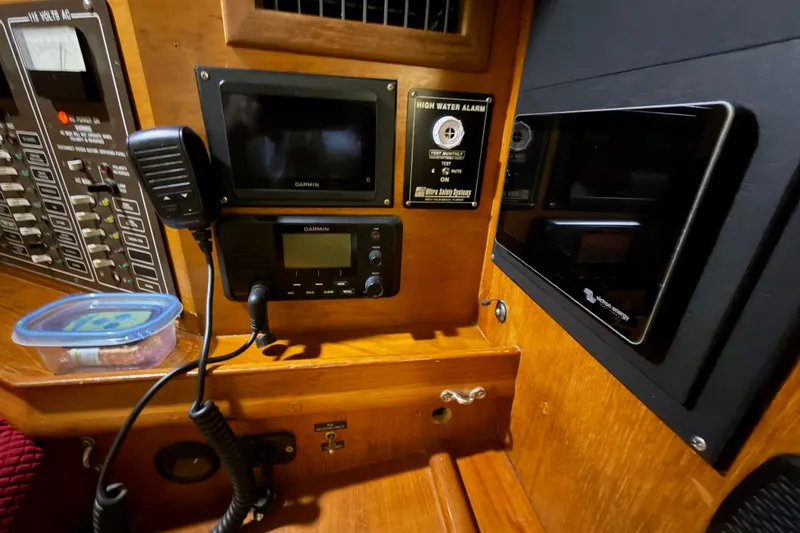 Slide: The Image of Control panel of a 1990 Island Packet 38 sailboat with Garmin electronics. - 14
