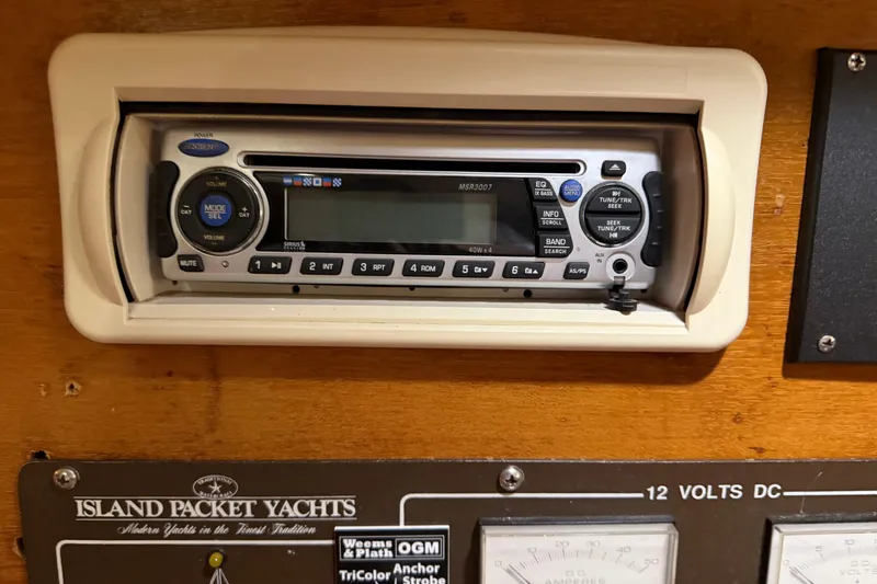 Slide: The Image of Control panel of a 1990 Island Packet 38 yacht featuring a Jensen stereo system. - 26