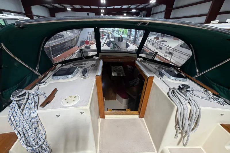Slide: The Image of Interior view of a 1990 Island Packet 38 sailboat with ropes and hatch details. - 51