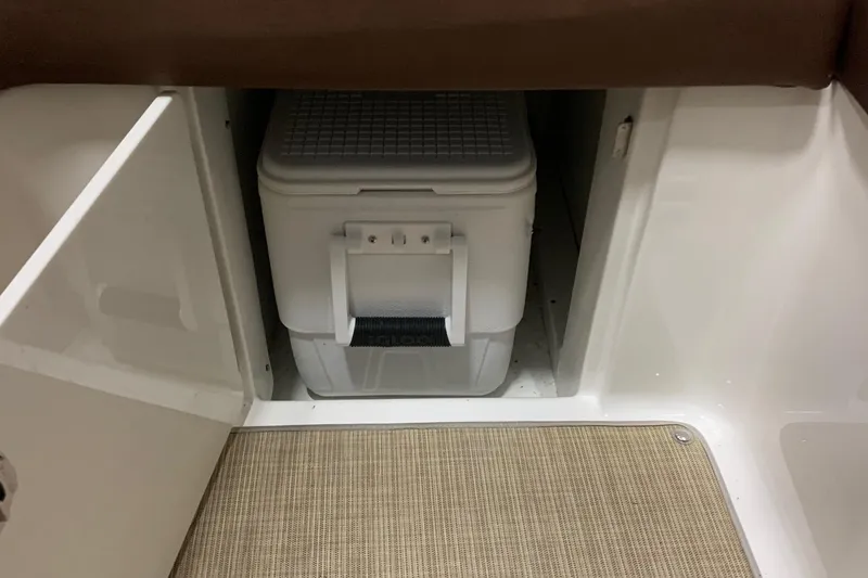 Slide: The Image of A cooler stored in a cabinet on a boat. - 15