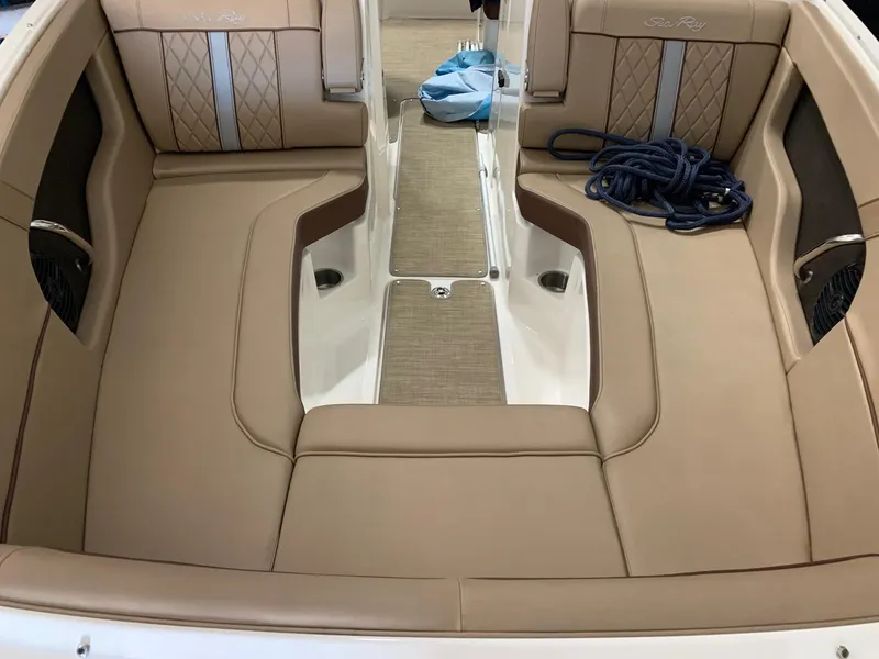 Slide: The Image of Interior of a Sea Ray 240 Sundeck with beige upholstery and rope. - 19