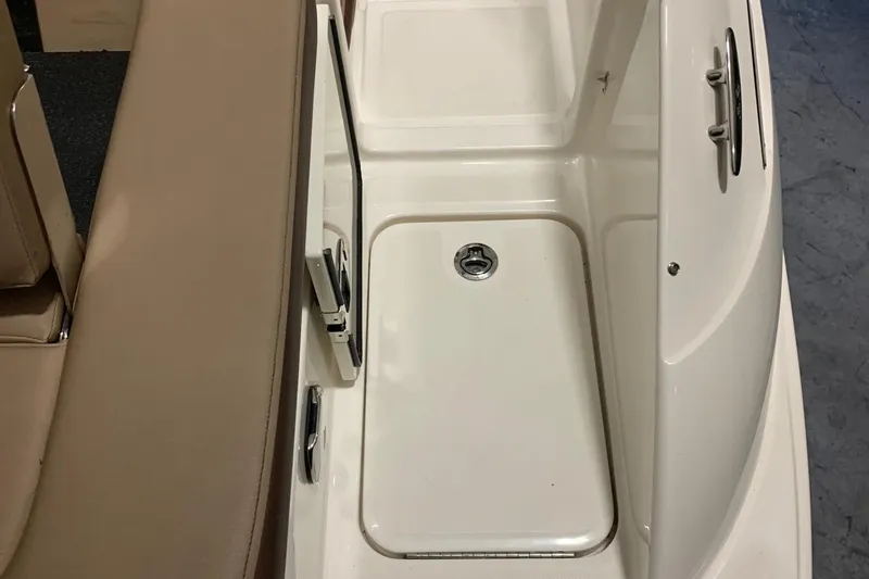Slide: The Image of Close-up of a boat deck with seating and storage area. - 20