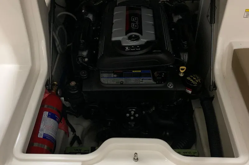 Slide: The Image of Engine compartment of a Sea Ray 240 Sundeck boat with a fire extinguisher. - 27