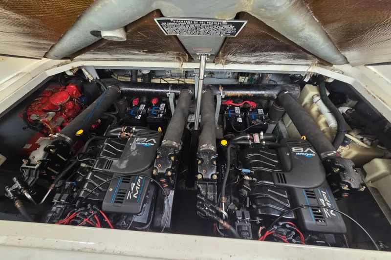 Slide: The Image of Engine compartment of a 1999 Sea Ray 340 Sundancer with dual V8 engines. - 20