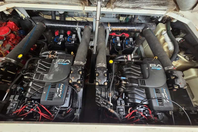 Slide: The Image of Engine compartment of a 1999 Sea Ray 340 Sundancer with dual V8 MerCruiser engines. - 21