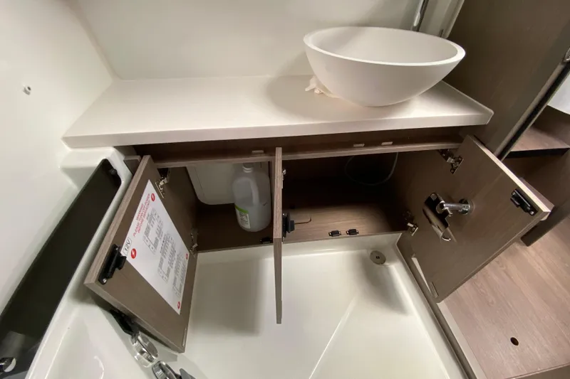 Slide: The Image of 2026 Jeanneau NC 895 Series 2 bathroom with open cabinets and modern sink design. - 50