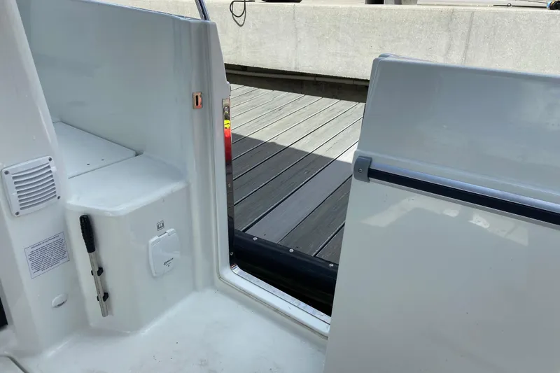 Slide: The Image of Interior view of 2026 Jeanneau NC 895 Series 2 boat, featuring a sleek white design. - 58